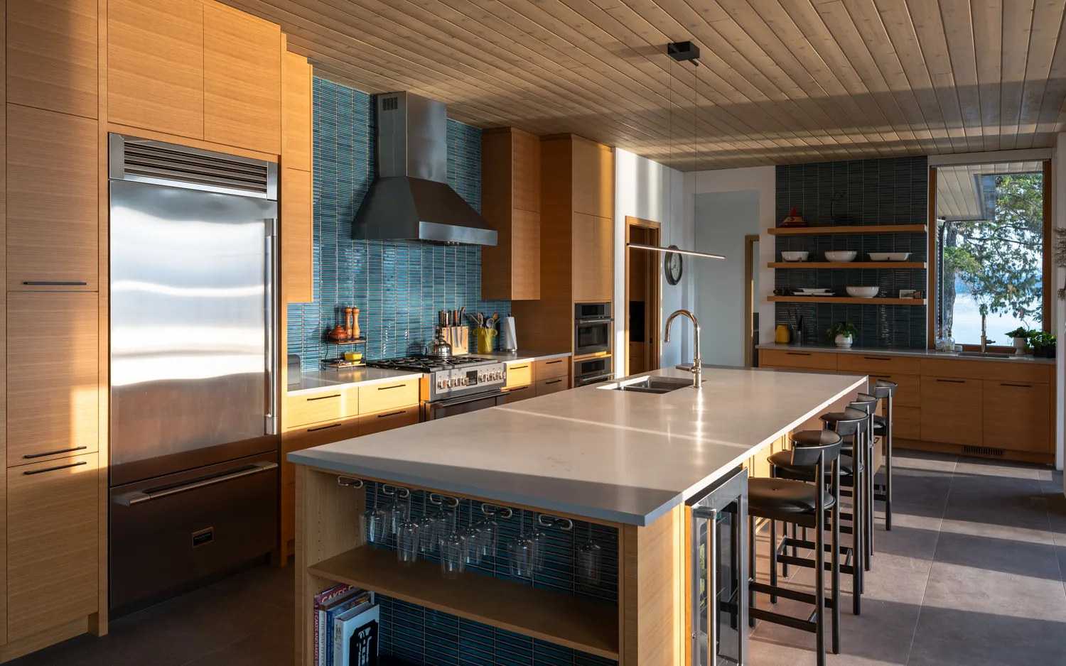 Salt Spring Island kitchen, teal tile and a long island toward the water
