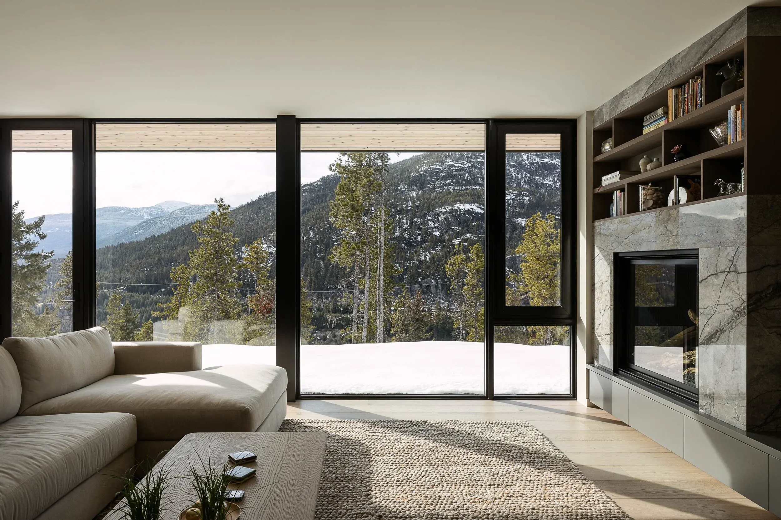 Warbler Residence fireplace and living room with evening light