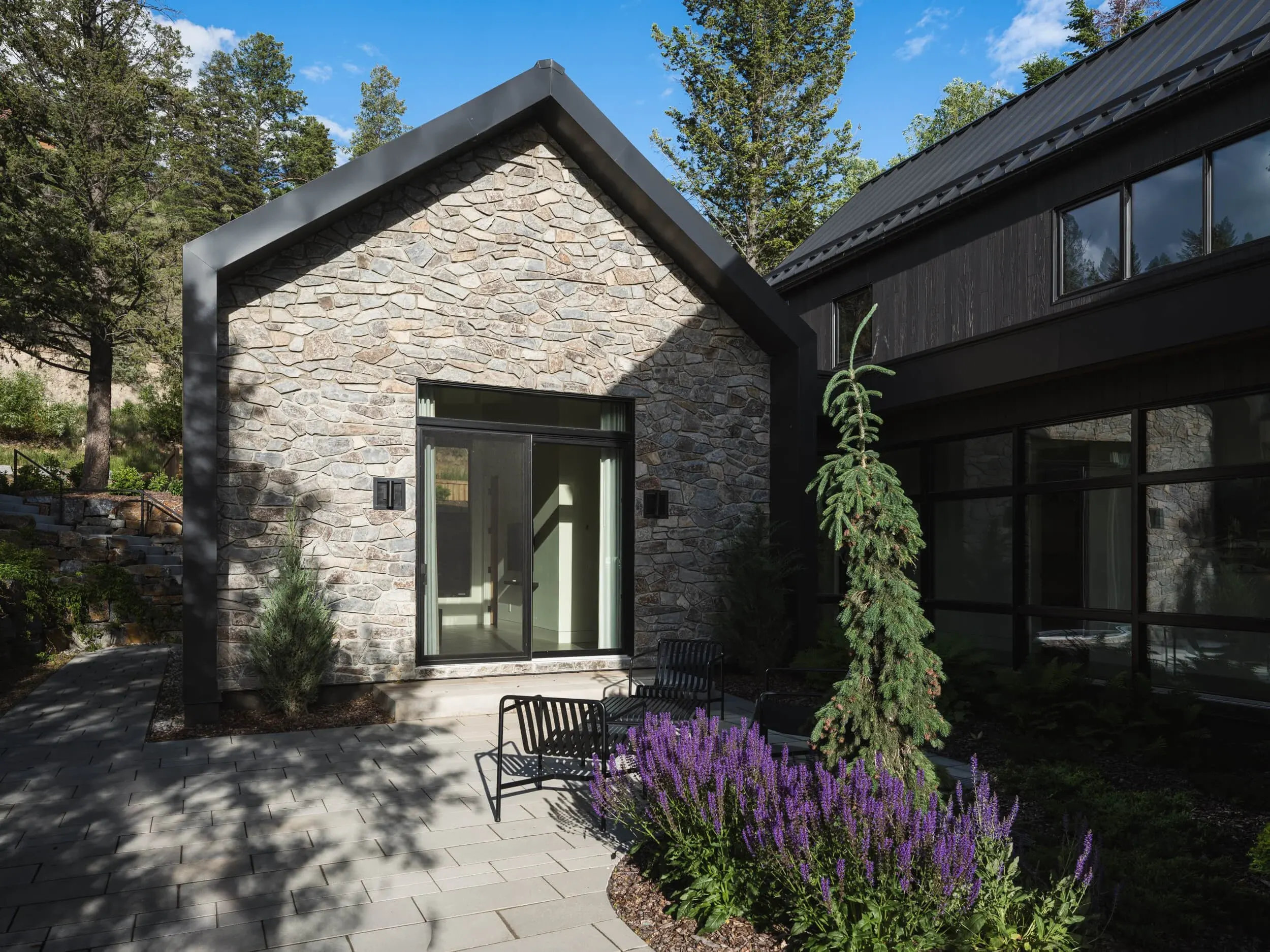 Coleman Residence stone gable with a weeping cedar