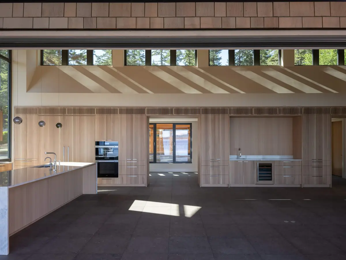 Unfurnished room with a full wall of pale cabinetry under a band of clerestory windows