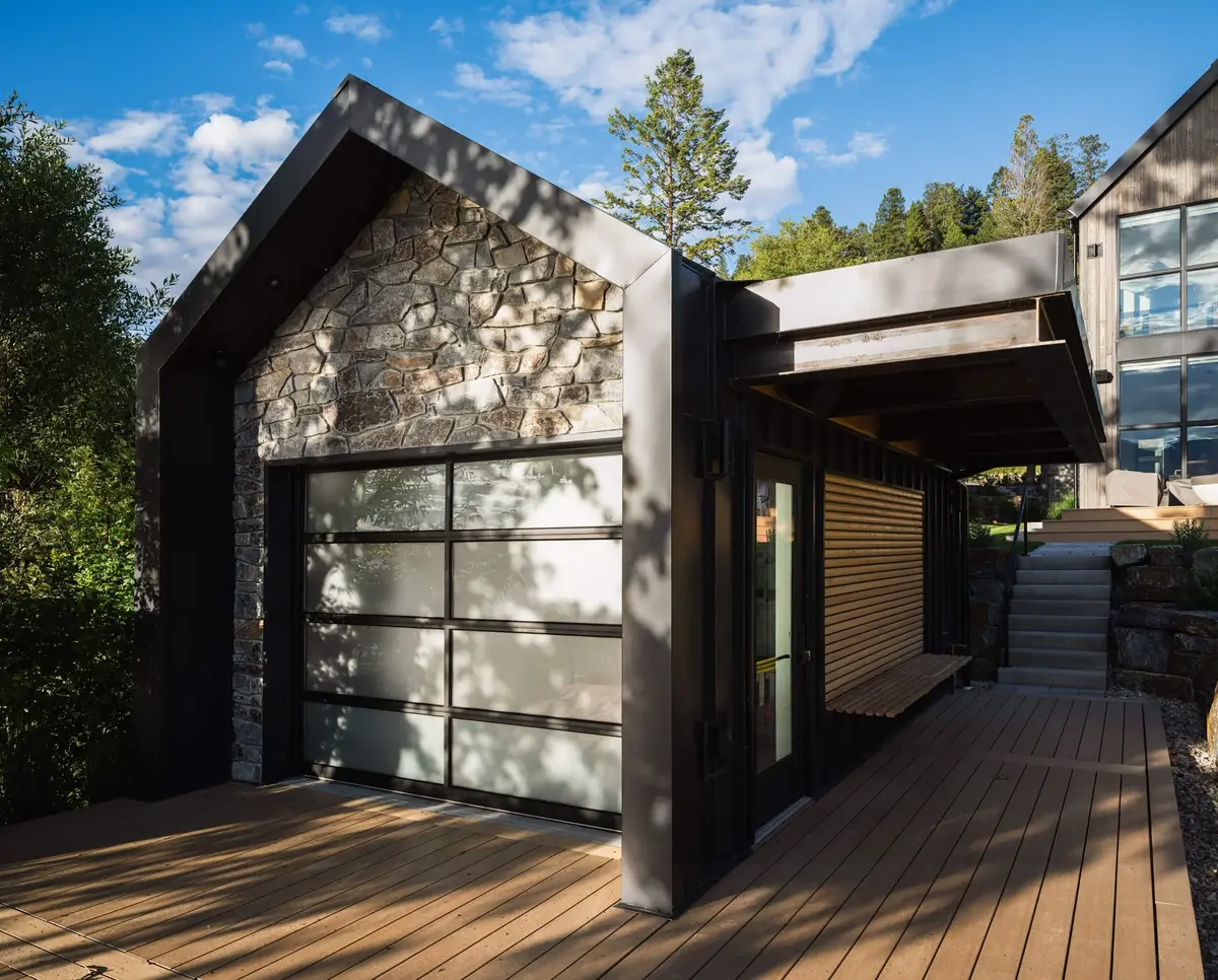 Deck at the cabana, a slatted screen rolled up over a bench beside a glazed door