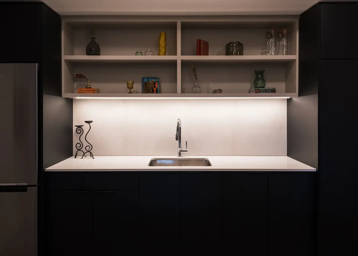 An open shelf above the kitchen counter