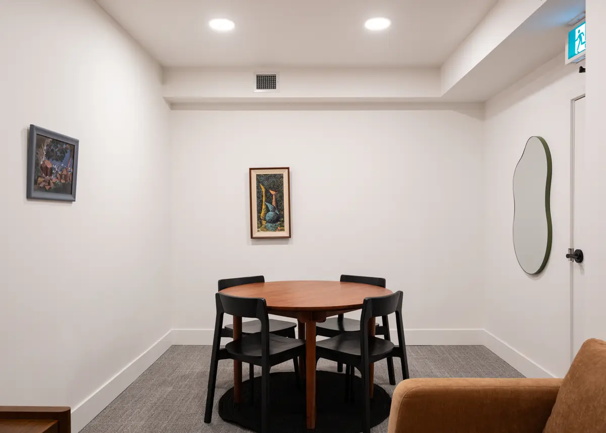 A round table and chairs in a meeting room