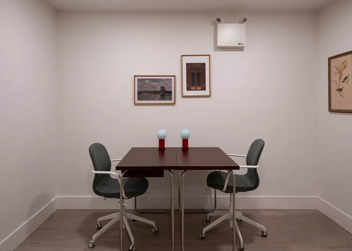 A small meeting table and two chairs