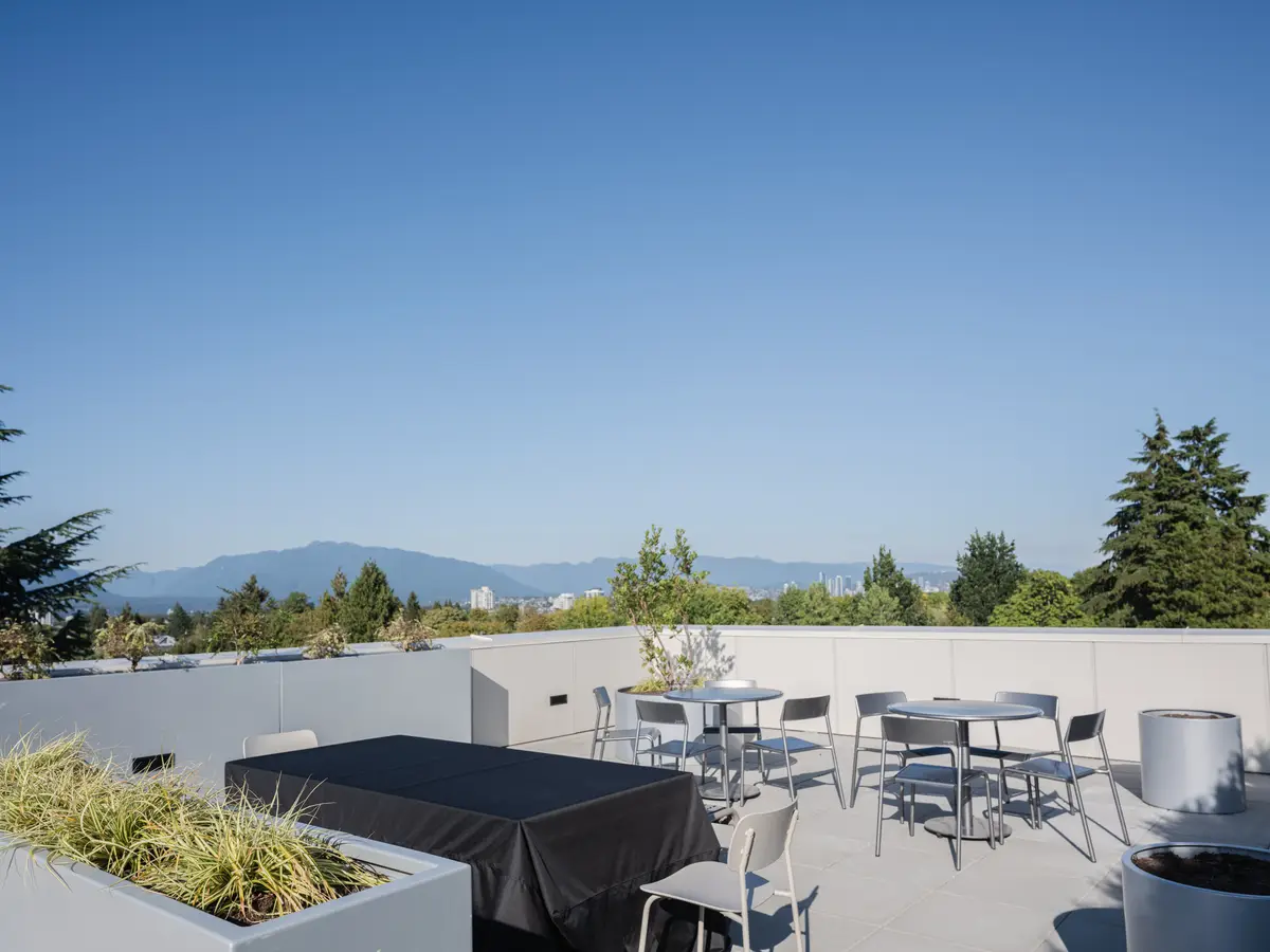 A dining table on the roof, mountains beyond