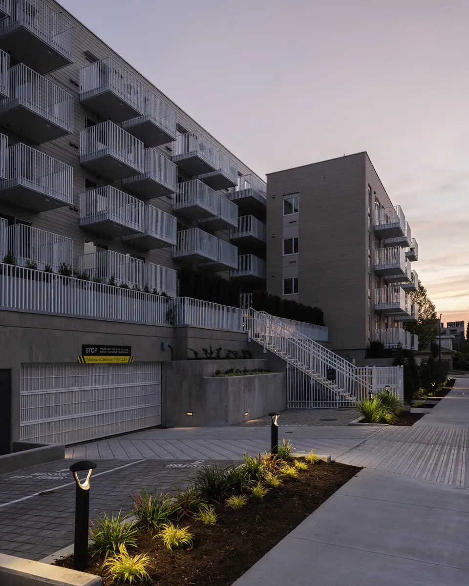 The open stair at dusk, a planted bed in the foreground