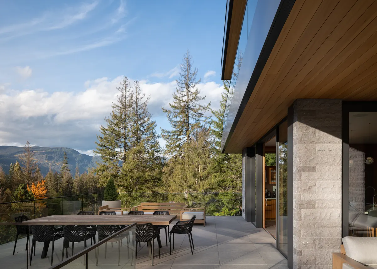 A dining table on the deck, mountains beyond, Panorama Ridge, Whistler