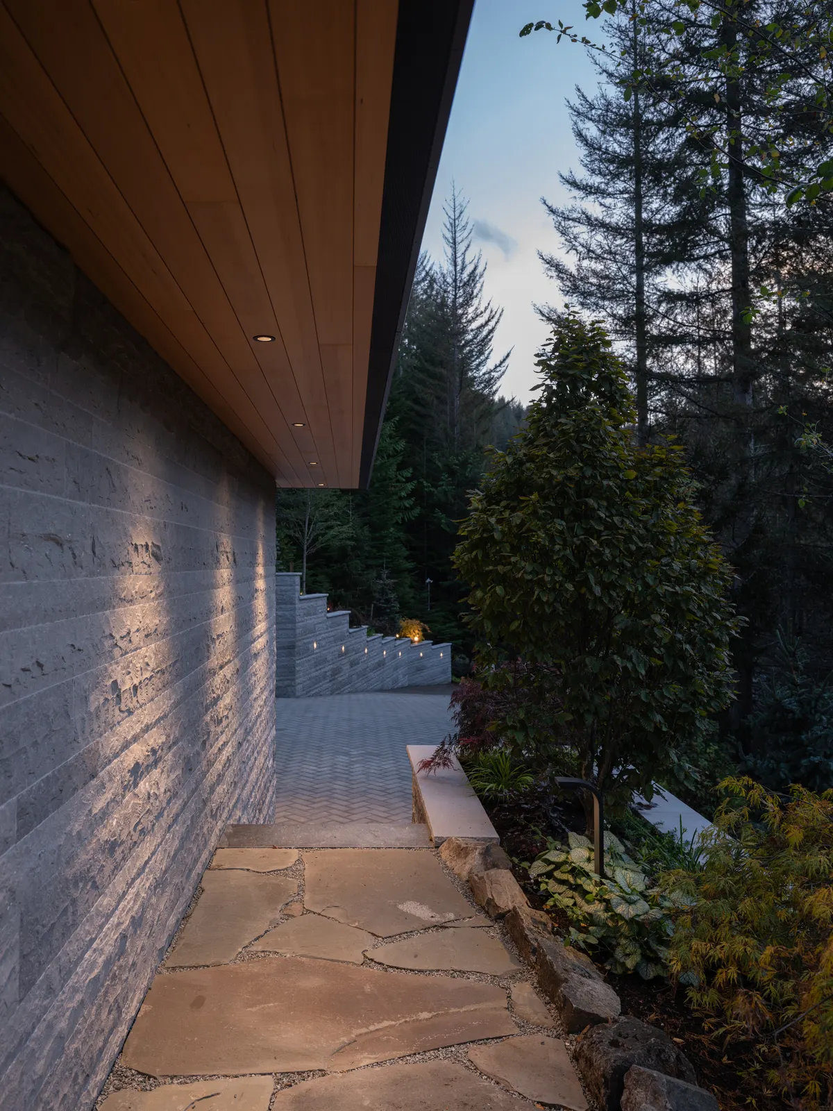 A stone path beside the house at dusk, Panorama Ridge, Whistler