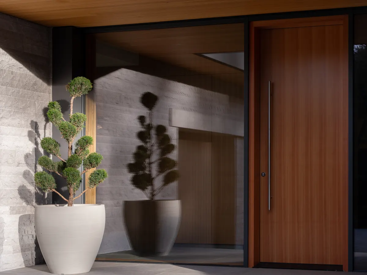 The wood entry door and two planters, Panorama Ridge, Whistler