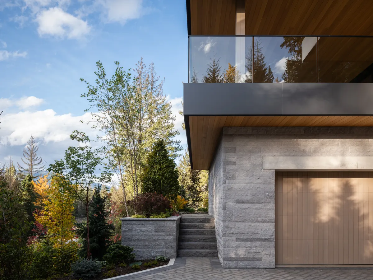 The garage elevation, a wood door in the stone base, Panorama Ridge, Whistler