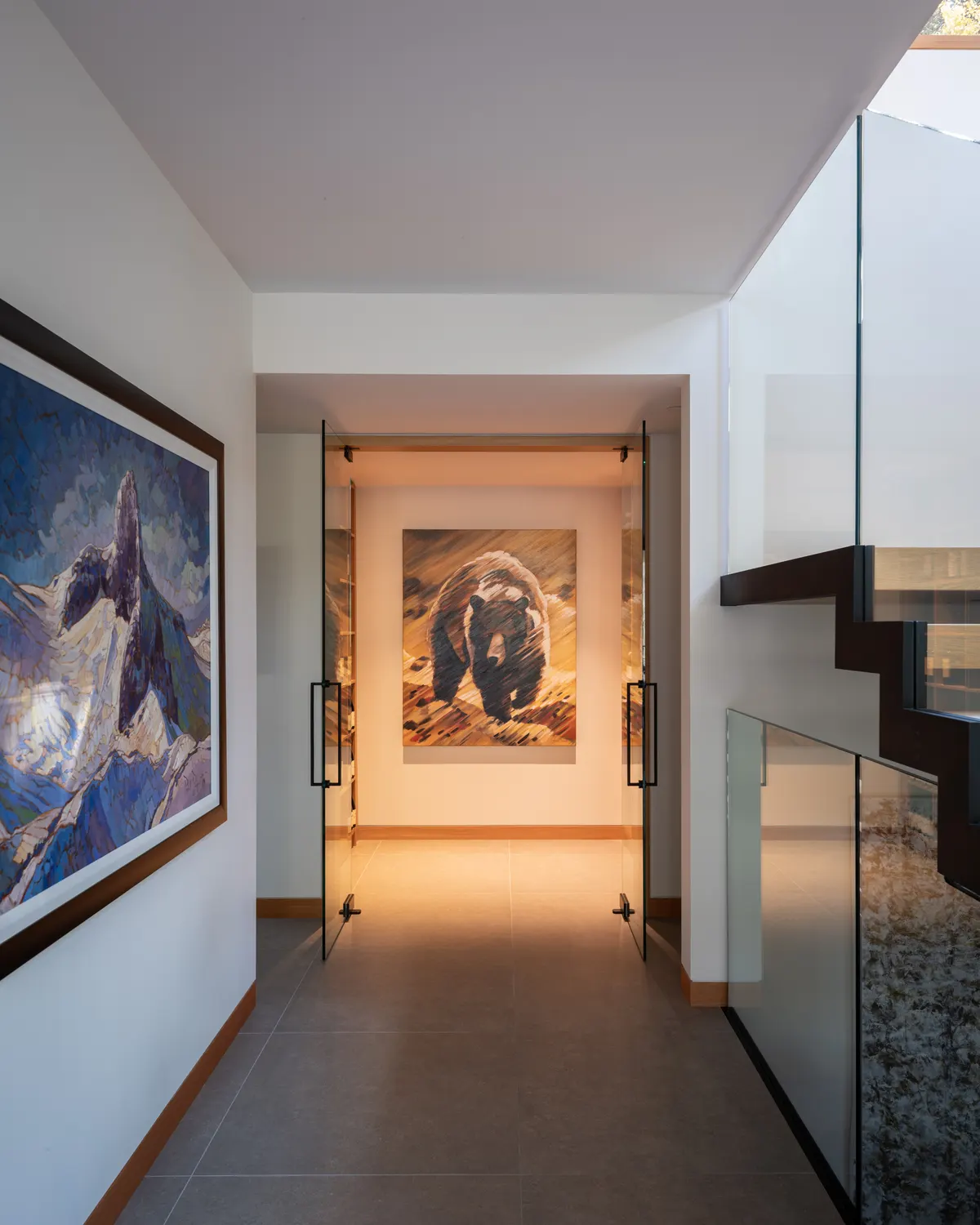 A hall with two paintings, glass to the stair at the right, Panorama Ridge, Whistler