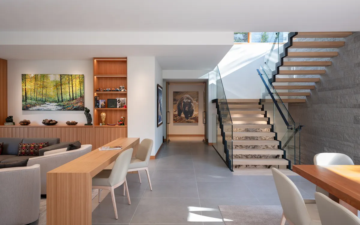 The living room, a long wood table, and the stair beyond, Panorama Ridge, Whistler