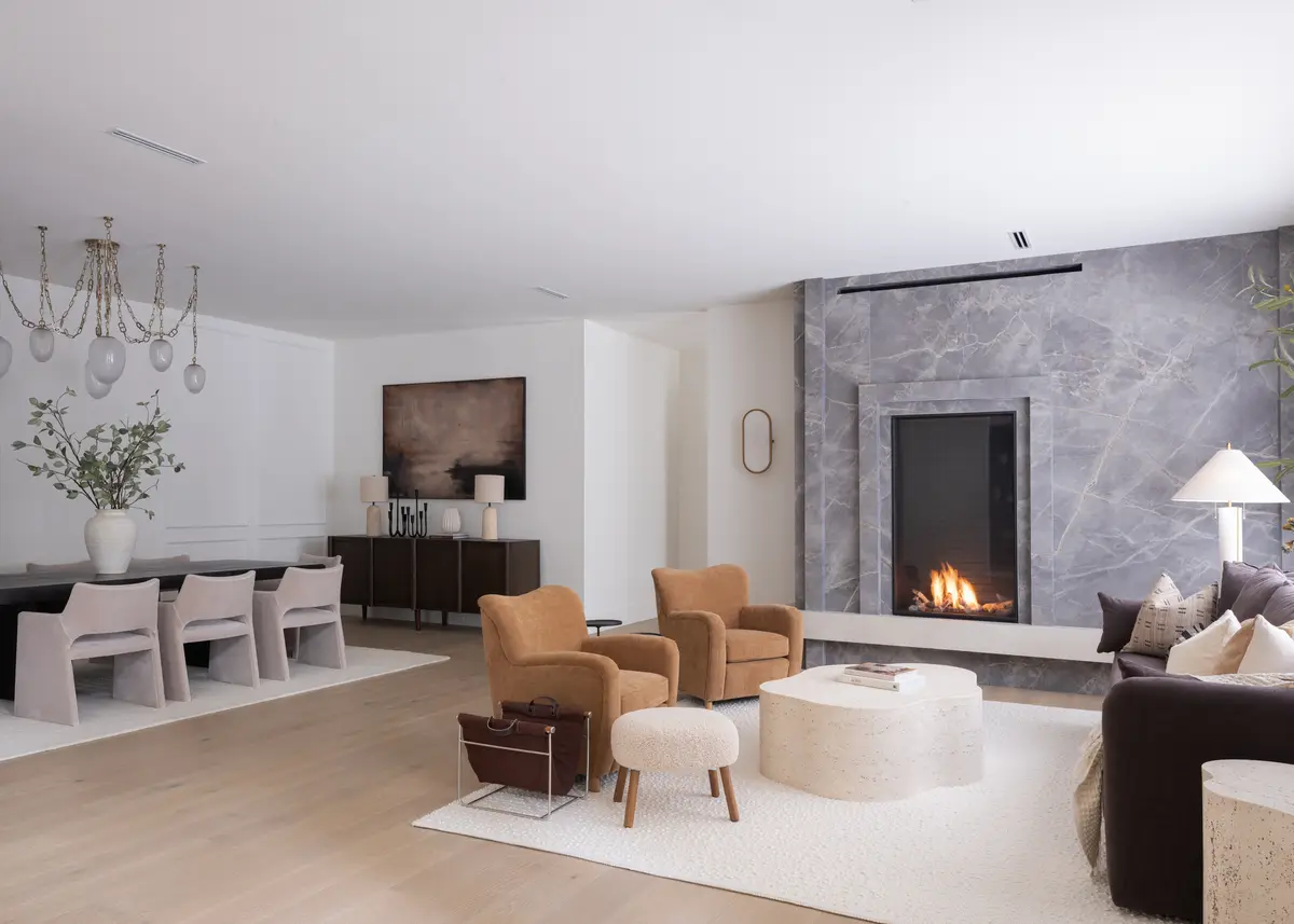 Dining and living in one room, the fireplace at the far end