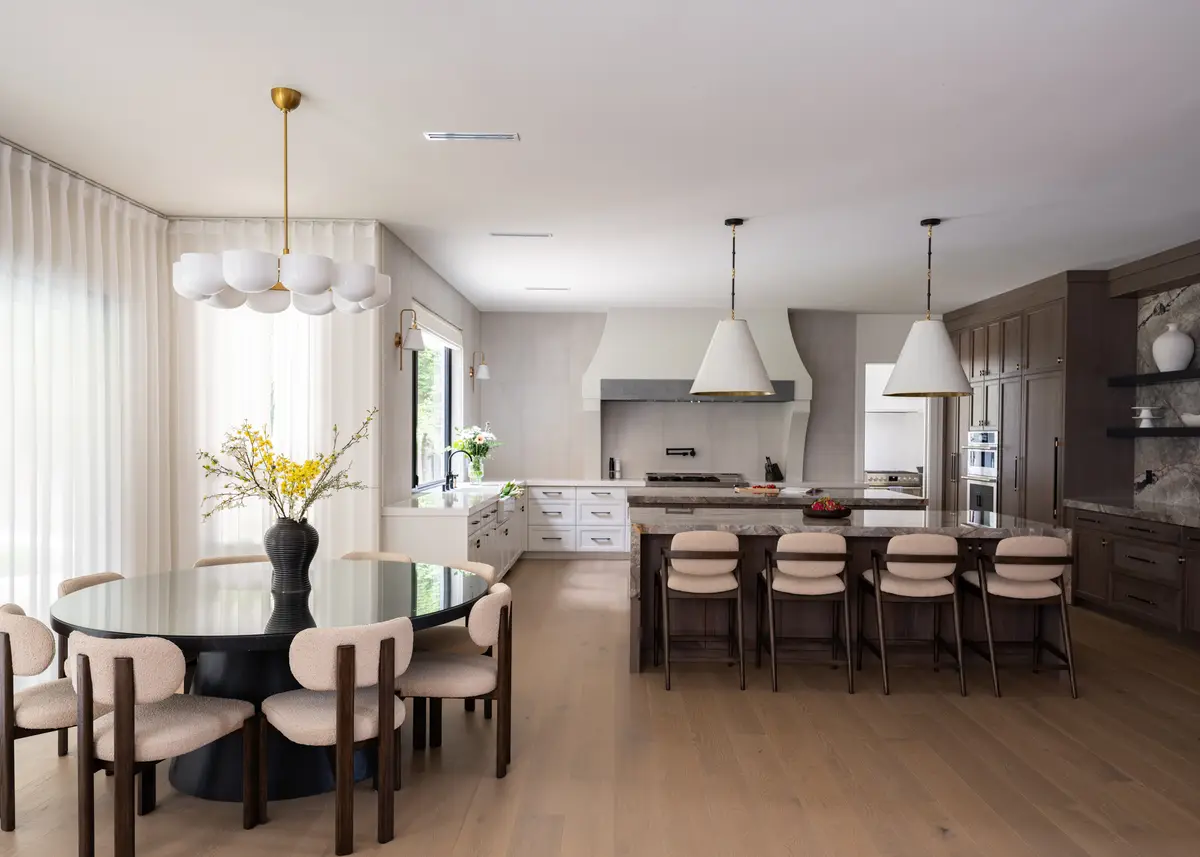 The dining table with the kitchen beyond