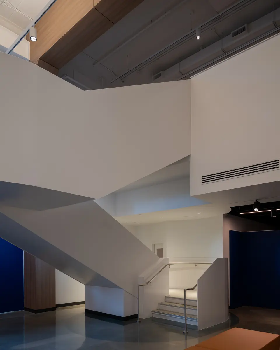 A stair beside a blue wall