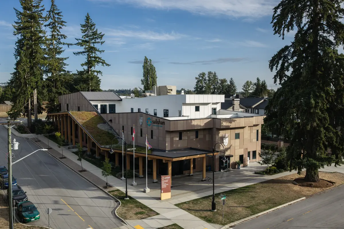 The street elevation with flags, the canopy at the entry