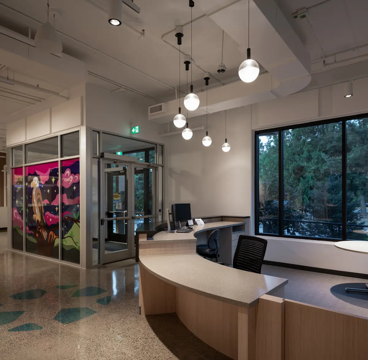 The reception desk and the window wall