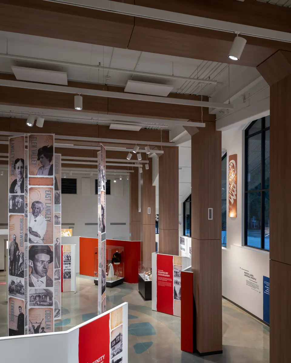 Hanging portrait banners between timber columns