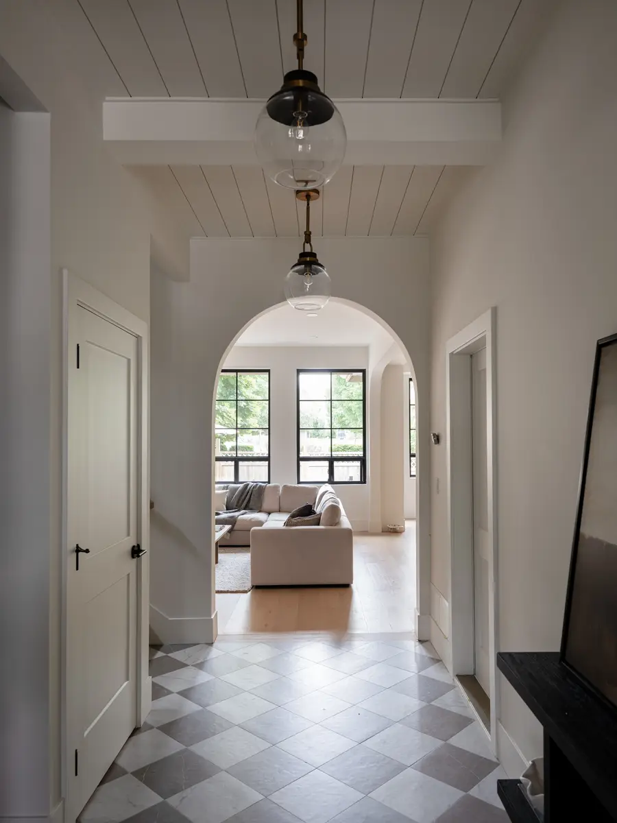The hall looking through an arch to the living room